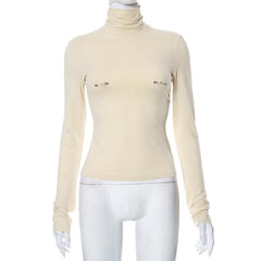 Metal applique turtle neck long sleeve solid top