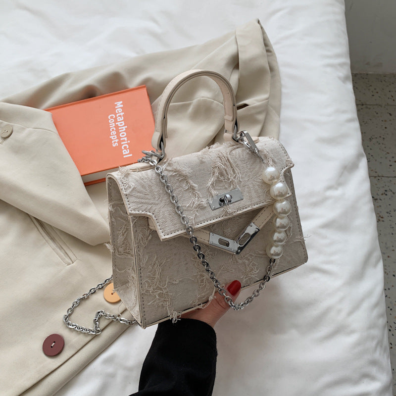 Faux pearl textured metal chain crossbody bag