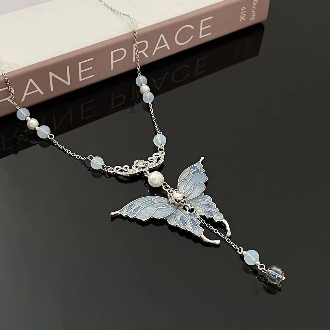 Blue butterfly pendant beaded necklace