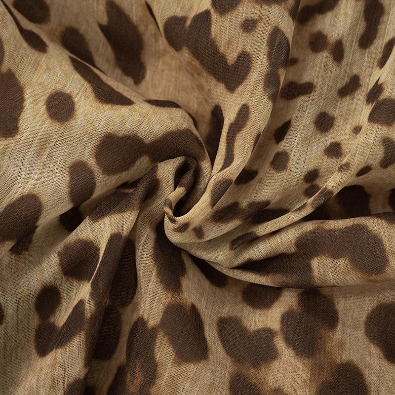 Halter cross front leopard print ruffle mini dress